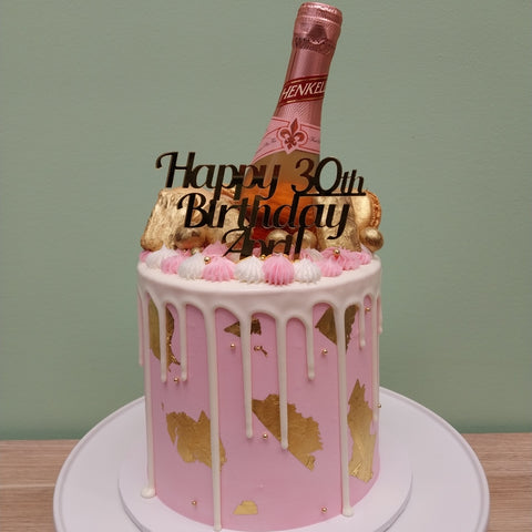 Tall Cake with Champagne Bottle