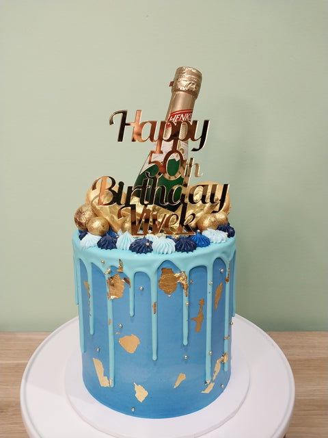 Tall Cake with Alcohol Bottles