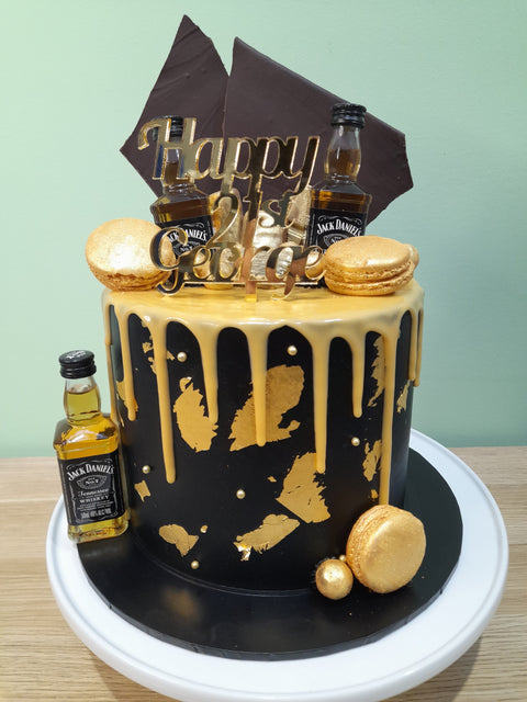 Tall Cake with Whisky Bottles