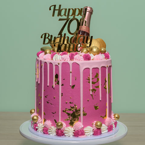 Tall Cake with Champagne Bottle