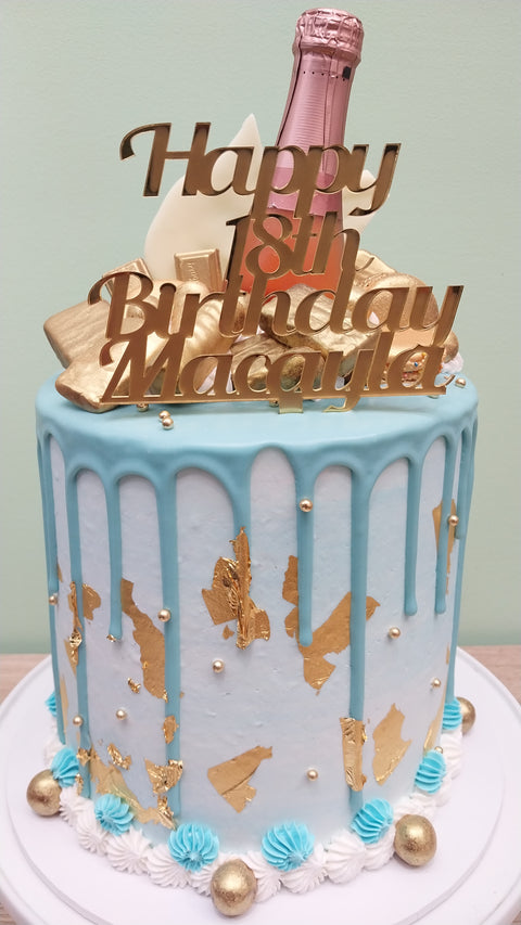 Tall Cake with Champagne Bottle