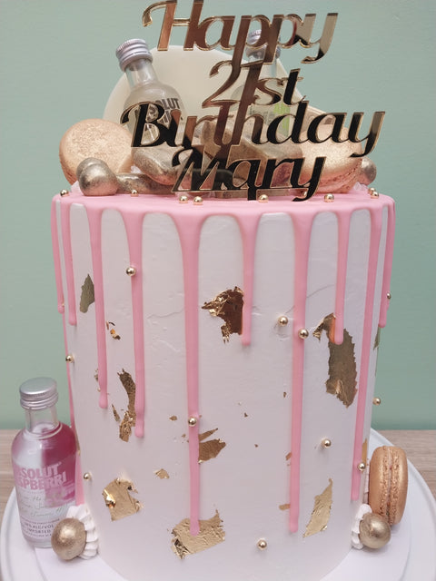 Tall Cake with Alcohol Bottles