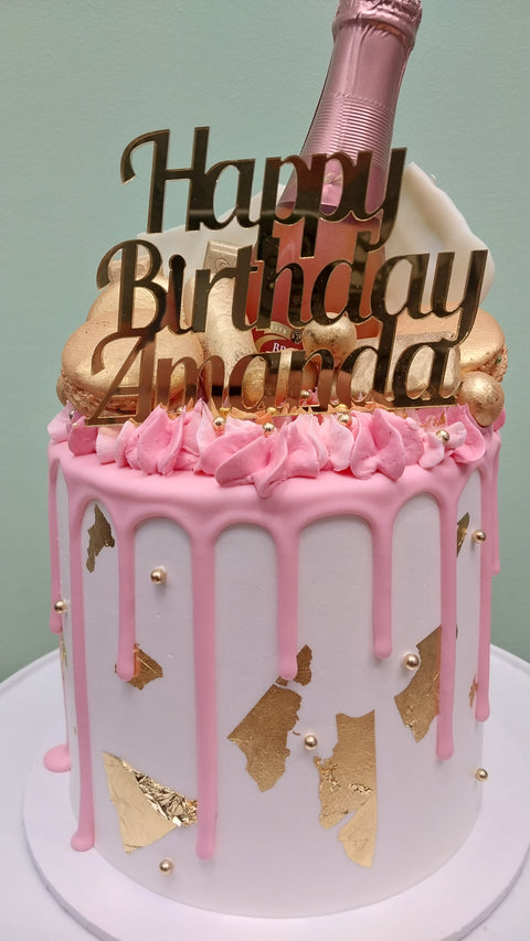 Tall Cake with Champagne Bottle