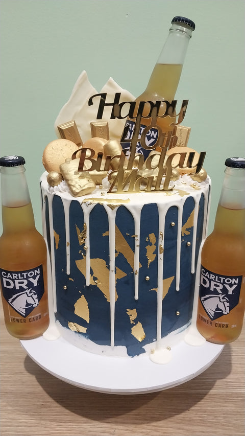 Tall Cake with Beer Bottles